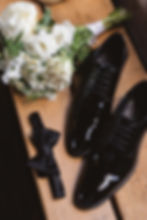 Groom's wedding accessories, shoes, tie, and flowers for wedding at Bartram's Garden in Philadelphia, PA. Photographed by South Jersey Philly wedding photographer Madison Neumann Photography.