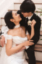 Bride and groom laugh together as they sit holding one another on staircase. Photographed at The Evermore Manor in West Creek, NJ by South Jersey, Philadelphia based wedding photographer Madison Neumann Photography.