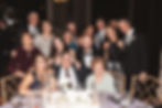 Newlywed bride and groom with a group of guests during wedding reception at The Switch House in Philadelphia, PA. "The Table Dash" wedding game photographed by South Jersey, Philly based photographer Madison Neumann Photography.