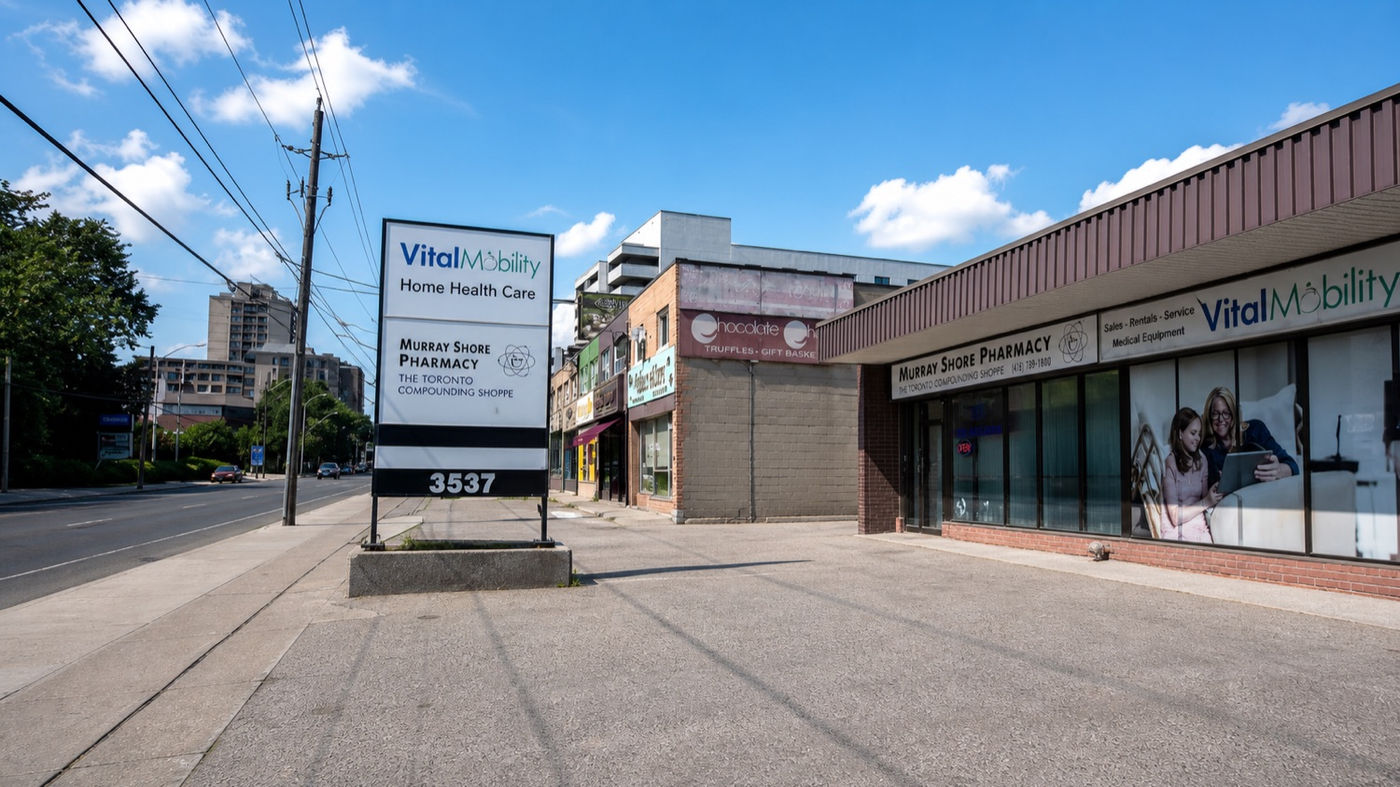 Wayfinding sign and parking at Murray Shore Pharmacy on Bathurst Street