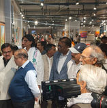 Guests viewing artwork at Pinkfest art exhibition at pinkfest