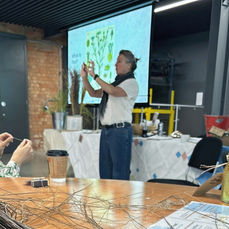 Amanda Haran presenting Derbyshire flax heritage beside retted flax stems at the Museum of Making in Derby.