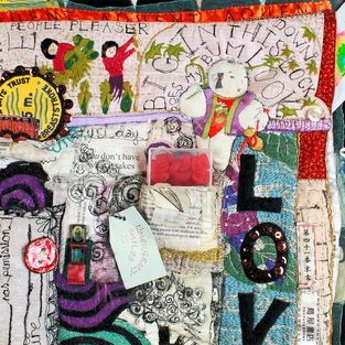 Close detail of stitching and surface work on Wilderness Quilt.