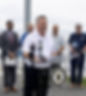Senator McKenney speaking at a press conference at the Rocky Point pier surrounded by elected officials.