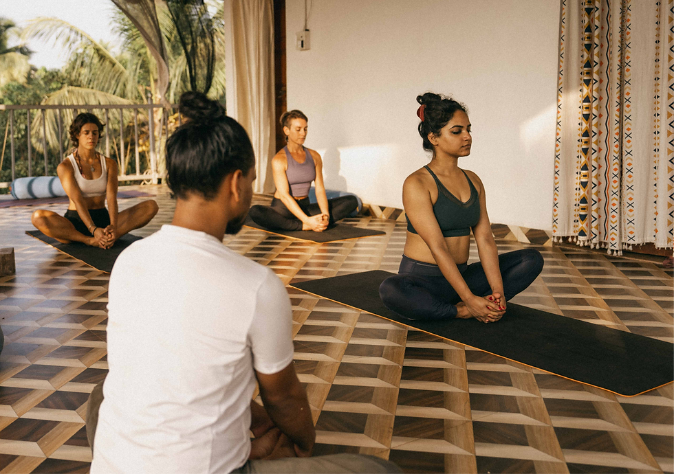 Close-up view of a yoga mat and props arranged for a restorative session