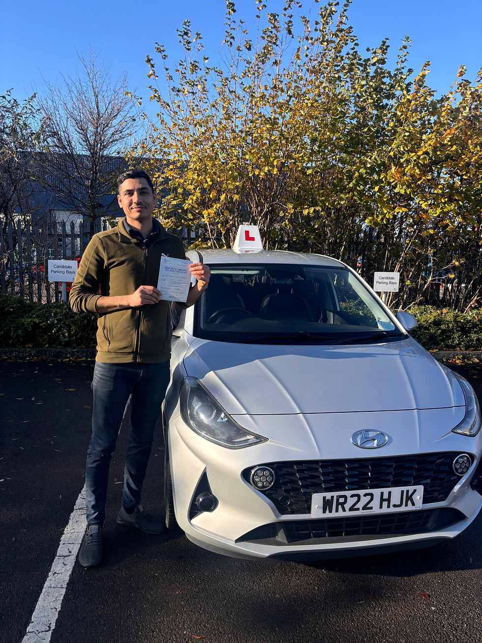 Manoj posing with his pass certificate on a sunny but cold day at Avonmouth test centre