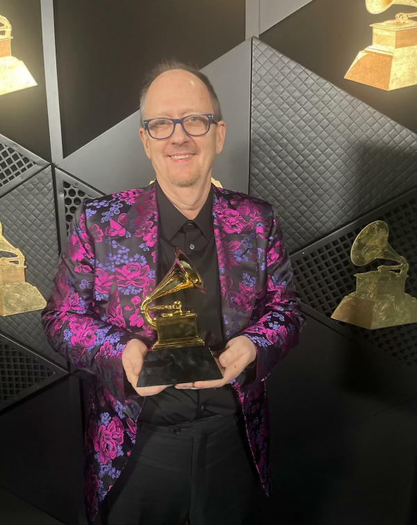 Jay Weigel 2024 Grammy winner wearing a floral brocade jacket styled by Claudia Wells of Armani Wells