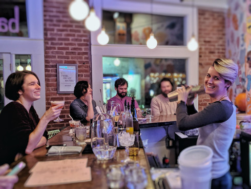 Sarah shaking a drink