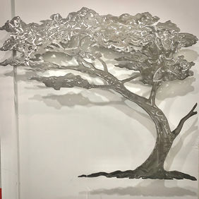 This sculpture is made from original hand drawings using laser-cut steel, ground / polished, oxidized with an acid wash, and sealed with UV protectant resin epoxy. Art floats 3” from wall on standoffs. Installation included.