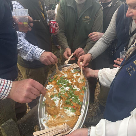 Group enjoying delicious food at The Woodland Dining