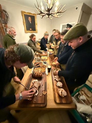 Group carving roasted meat at The Woodland Dining