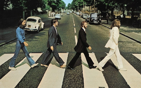 a picture of the beatles walking at abbey road