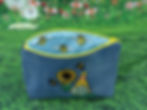 Thumbnail: Cosmetic bag, upcycled from jeans. Displaying a Gonk with sunflower and bees. Bee lined bag