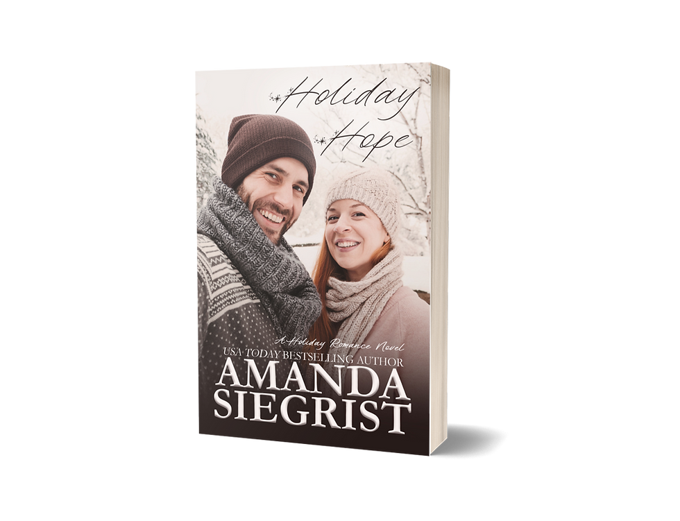 Snow-filled background scene with a smiling couple front and center. The man is on the left wearing a brown hat and brown and white sweater. The woman is on the right wearing a tan hat with a light pink sweater. On the top is the title Holiday Hope. On the bottom is USA Today Bestselling author Amanda Siegrist