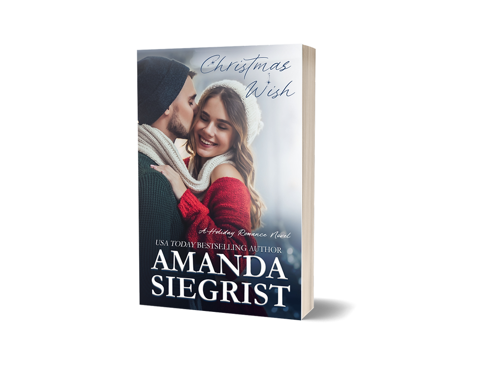 A couple embracing with the man kissing the woman's cheek. He's wearing a black winter hat with a black sweater. She's wearing a white winter hat and a scarf that's wrapping around his neck as well. She has on a red sweater. On the top is the title Christmas Wish. On the bottom is USA Today Bestselling Author Amanda Siegrist