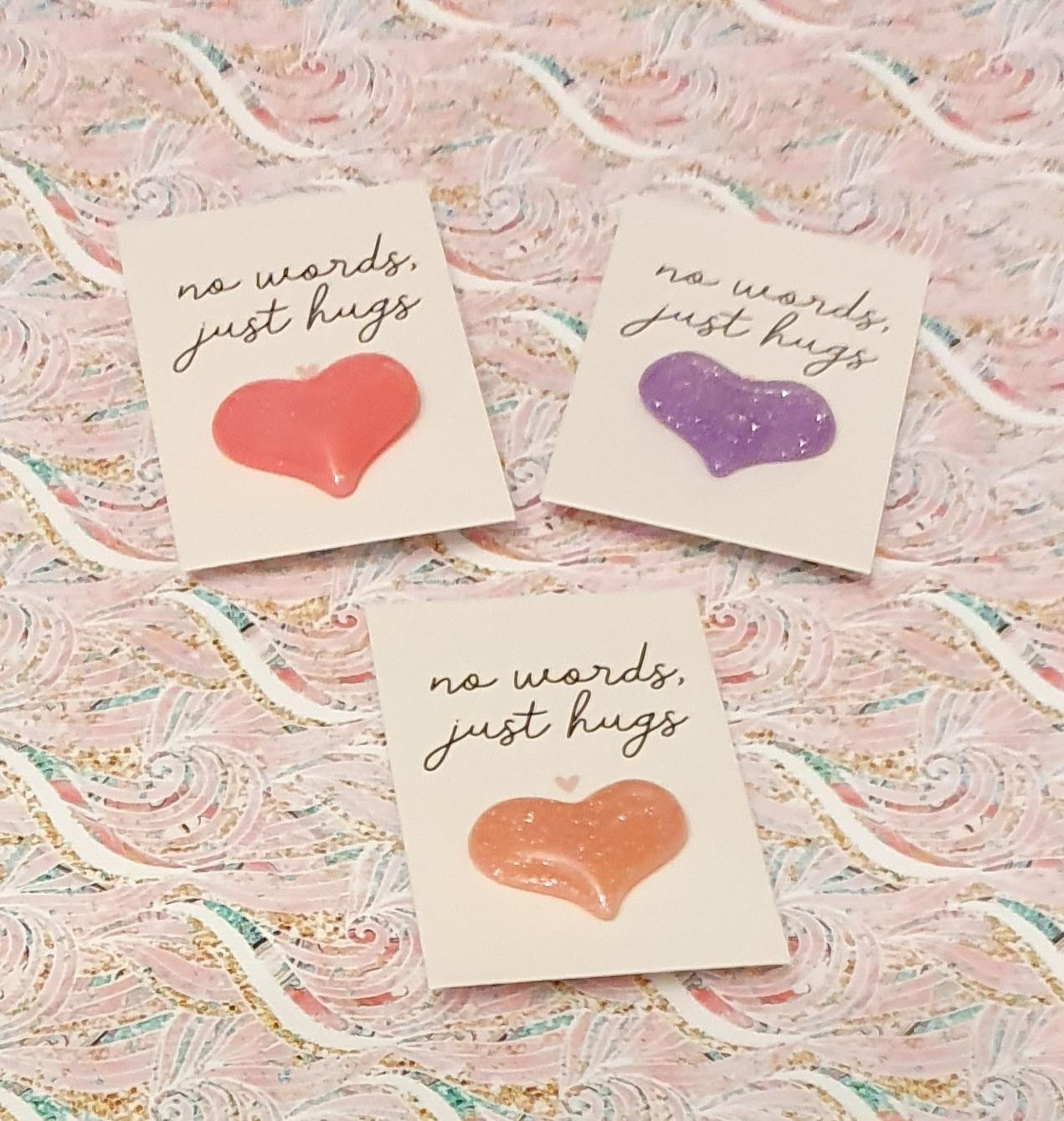 Heart shaped pocket hug pin badges
