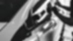 Black and white close up photo person installing a vinyl wrap on a car_edited.jpg