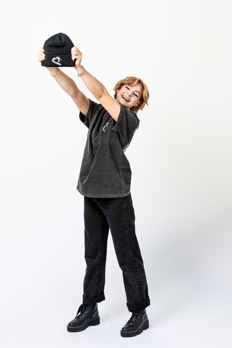 kallmekris tossing hat up while posing in Otto apparel