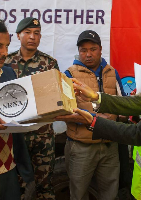 President Shesh Ghale donating medical supplies