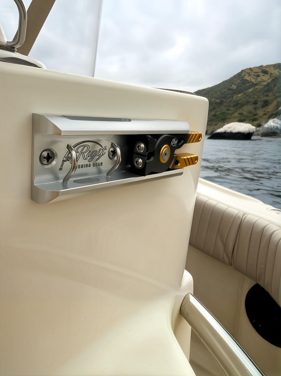 Rigit Face Mount with clear anodized finish and integrated clippers mounted on a boat out on the water.