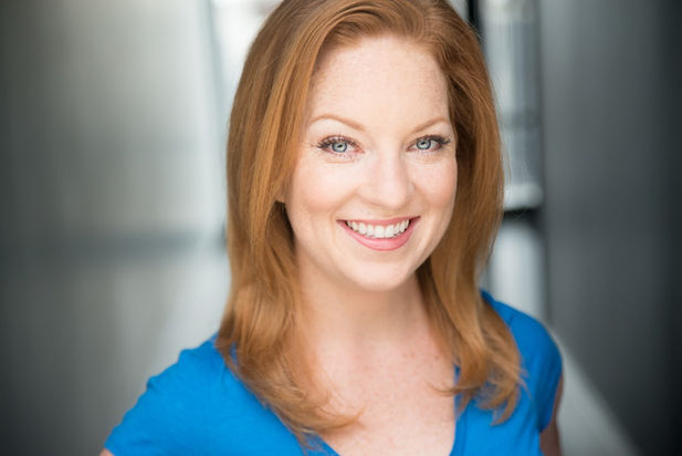 Emily Derrick headshot blue.jpeg
