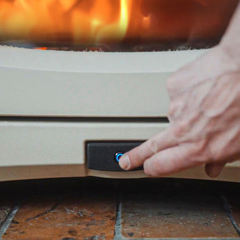 a picture of an intelligent woodburning stove being controlled via button