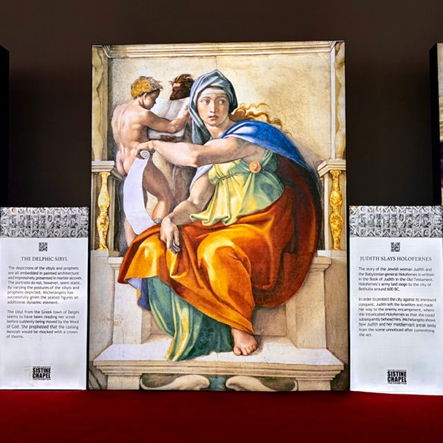 The Delphic Sibyl fresco reproduction featuring vibrant restored colors at Michelangelo's Sistine Chapel Exhibition