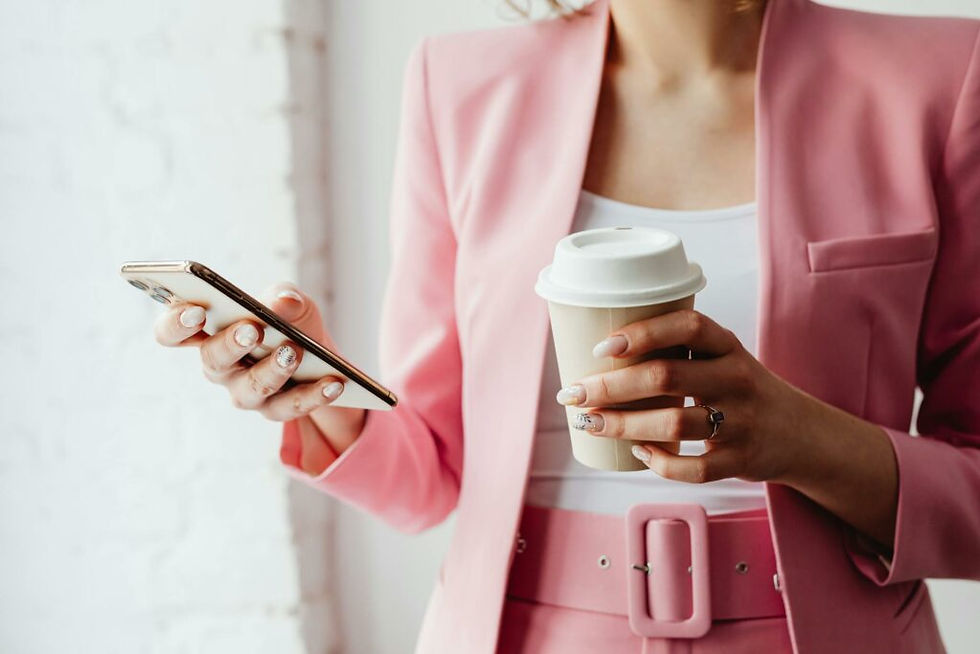 Photo by Photo By: Kaboompics.com: https://www.pexels.com/photo/a-woman-holding-a-cup-of-coffee-while-using-her-smartphone-7680203/