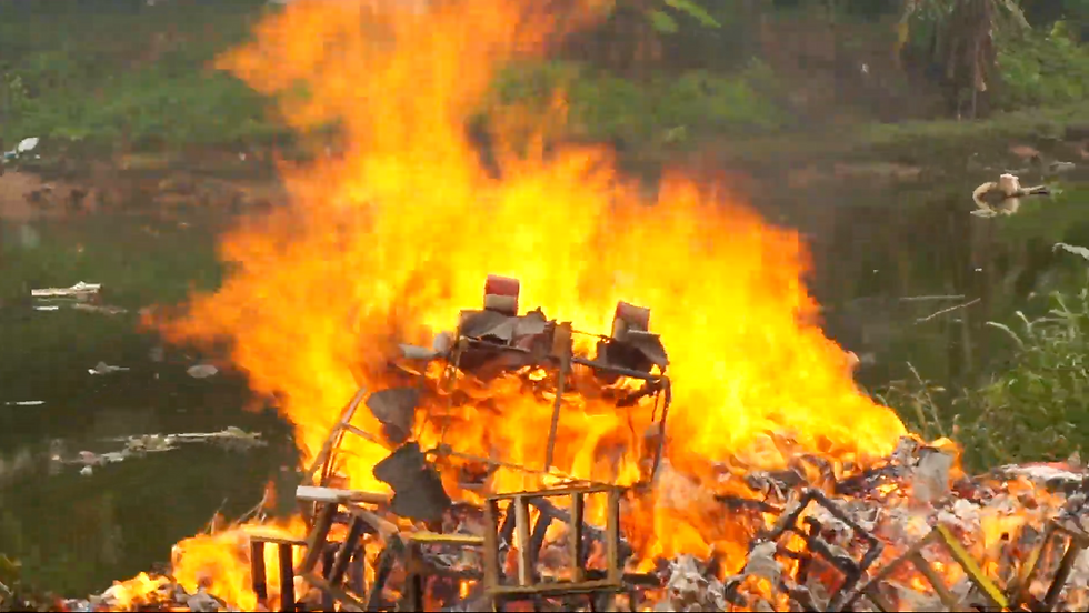 Joss paper burns brightly after a temple ceremony. (Source: The Global Pulse)