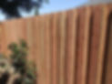 New wood privacy fence with vertical planks