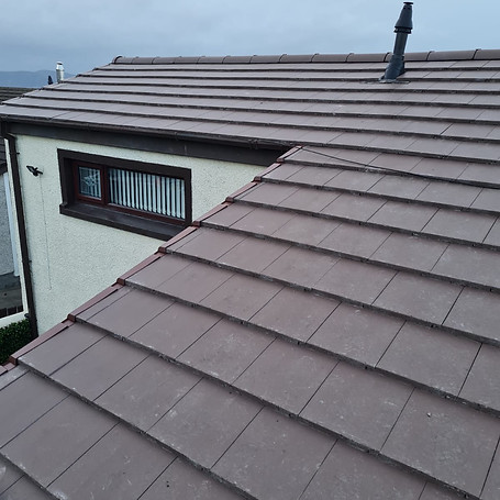 New slates being installed on a pitched roof