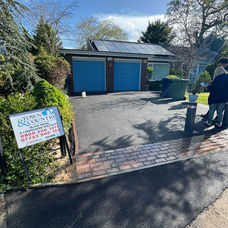 New tarmac driveway with a red brick paver apron
