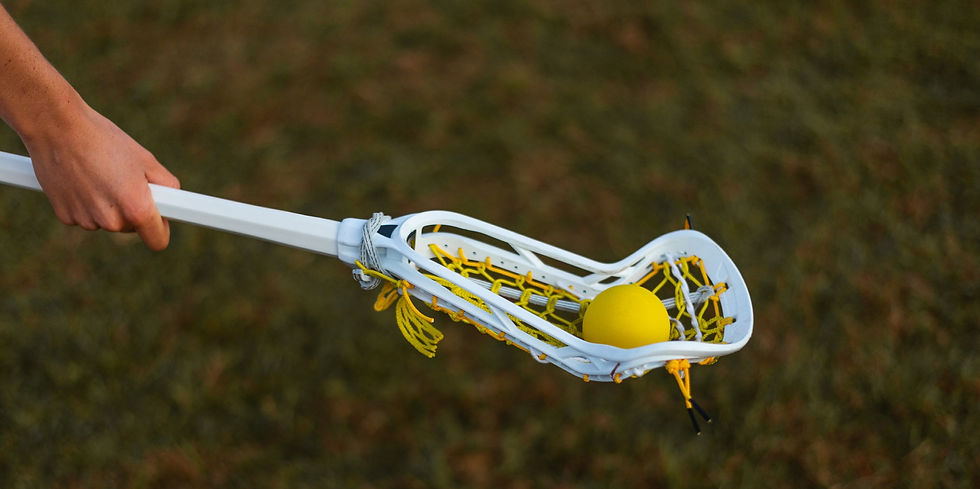 Lacrosse player cradles lacrosse ball