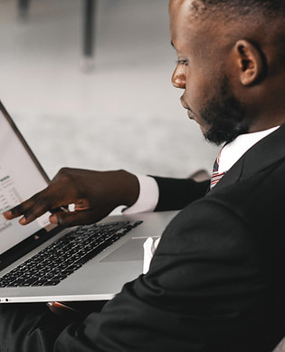 A man pointing at his laptop screen_edit