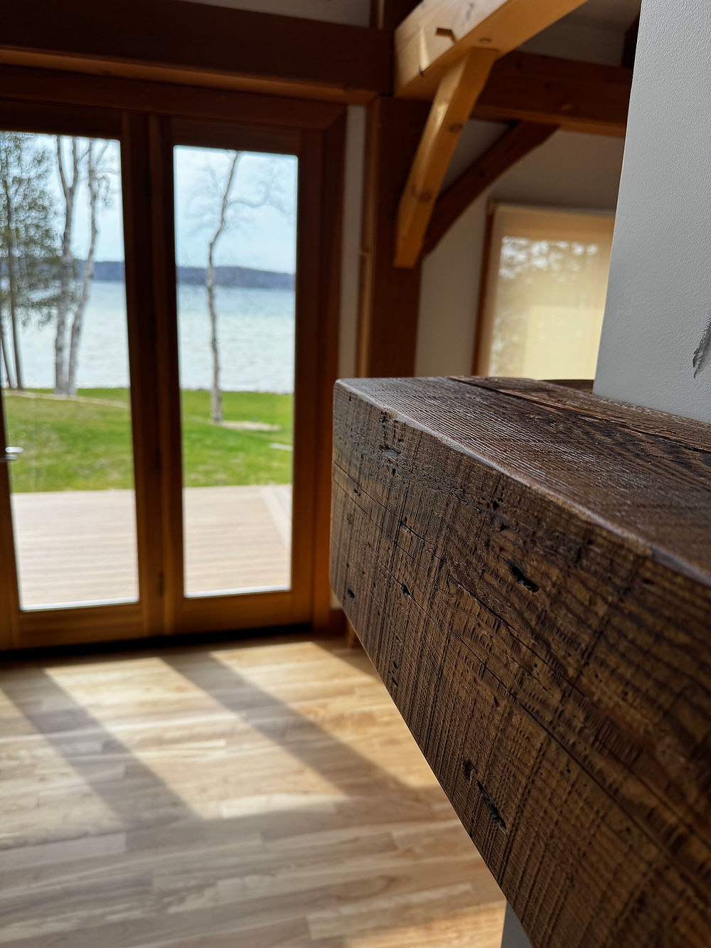 Northern Michigan Reclaimed Barnwood beam overlooking a lake