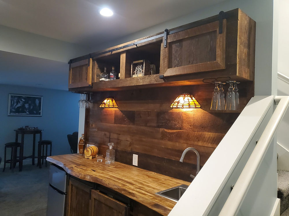 Custom Barnwood Bar with rolling doors and slab bar top