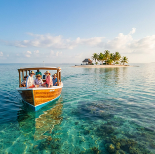 Boat with people in hats on turquoise water near a small island with palm trees under a clear blue sky. Relaxed and tropical mood.