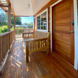 Relaxing outdoor deck at Cashew Tree Cabana, perfect for unwinding in Maya Beach