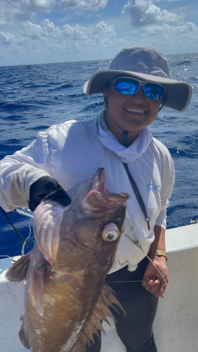 Woman holding A Big fish Placencia