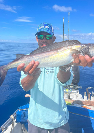 Man Holding small fish Placencia