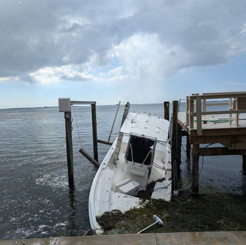 Boat fell off the boat lift during the storm surge of hurricane helene. Boat was taking on water. Specialty dock solutions was able to repair the boat lift, drain the boat, and get it back on safely.