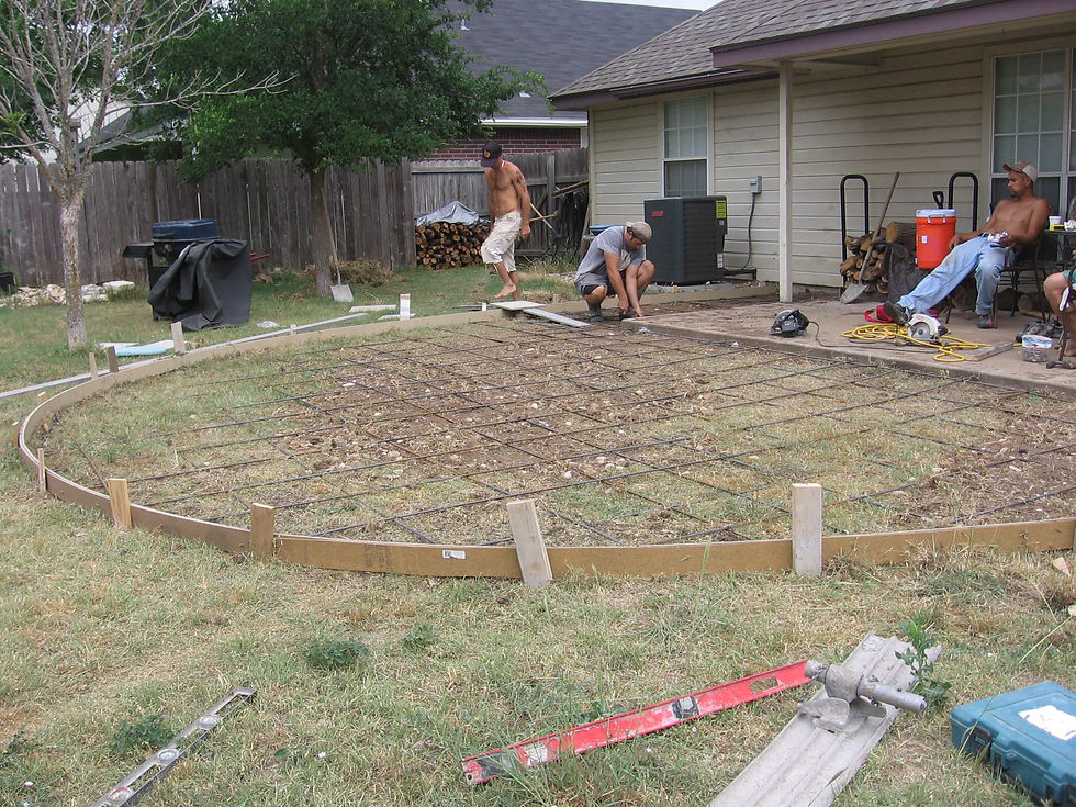 Shaping the patio and adding rebar. The two trees you see were the only source of shade, but one was dead. The green Cedar Elm is huge now.