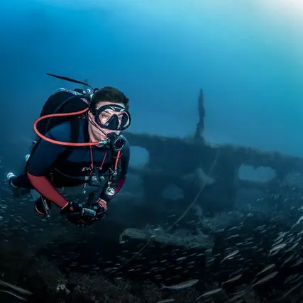 A diver during a decompression dive charter in front of a ship wreck with Instigator fishing and diving charters