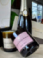 Louis Roederer champagne, candles, and gift card
