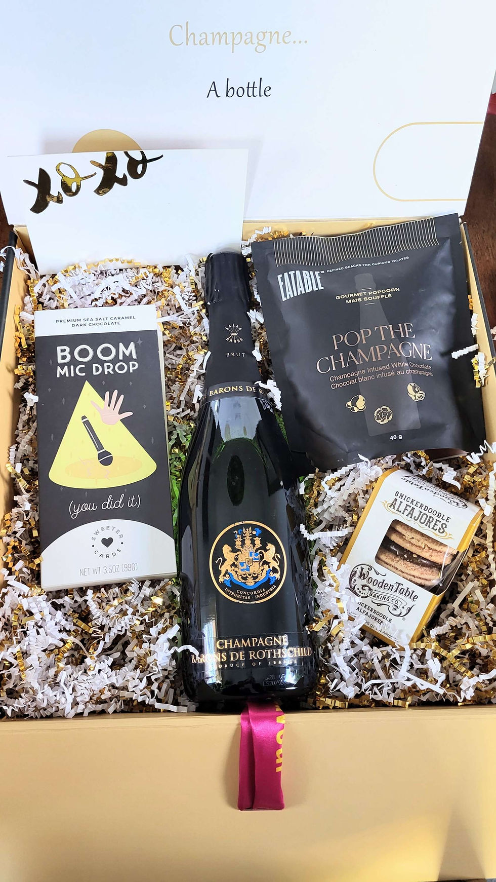 Champagne, chocolates, and Boom Mic Drop game gift box