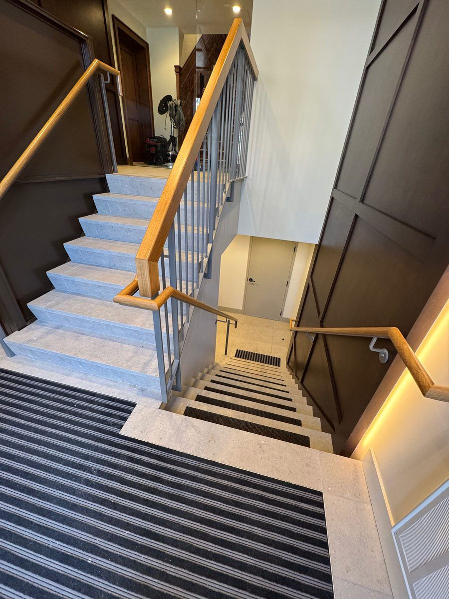 Stair runner and carpeted treads installed by Lino's Flooring
