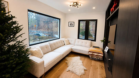 Modern living room with white sectional and large window