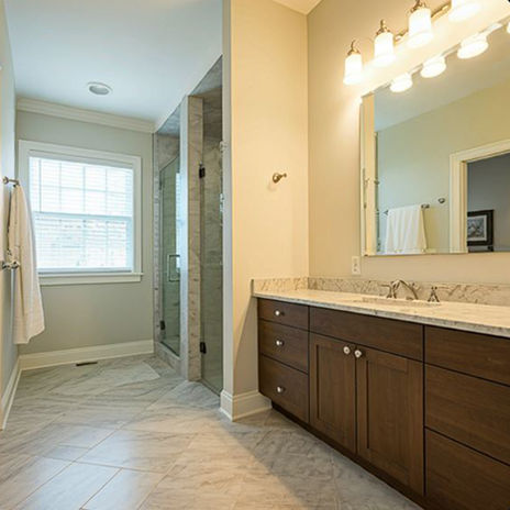 Custom bathroom renovation in Toronto with long vanity and double mirrors