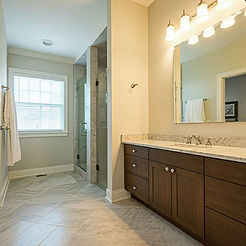 Modern bathroom renovations Toronto featuring wood vanity.