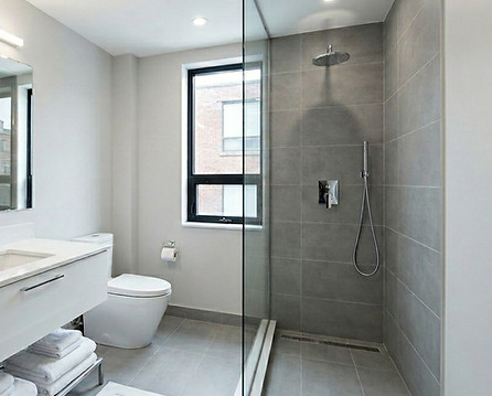Modern bathroom renovations Toronto featuring glass shower.